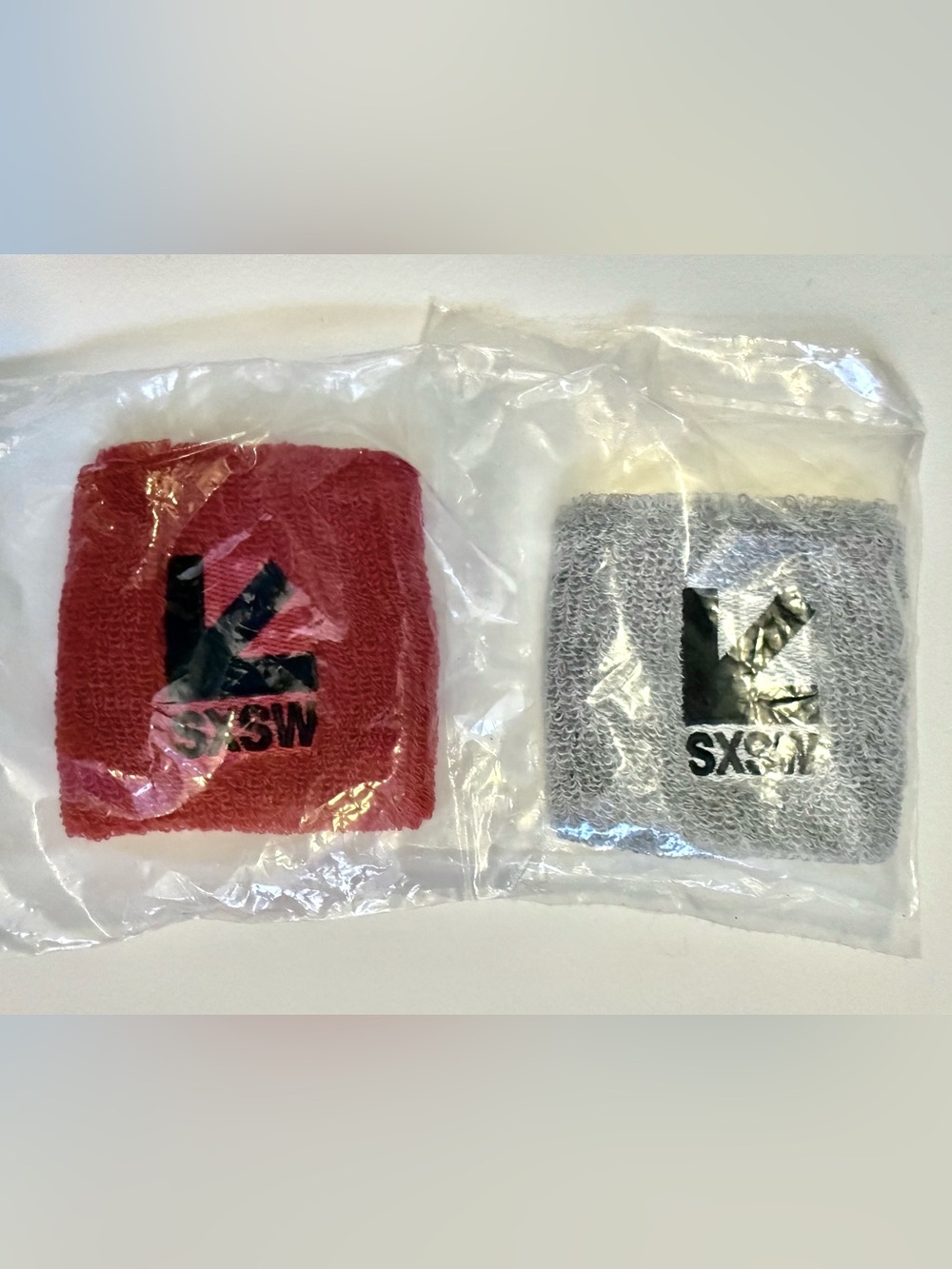 New & Unopened Red and Gray Terry Wristband with Black SXSW Logo- Set of 2